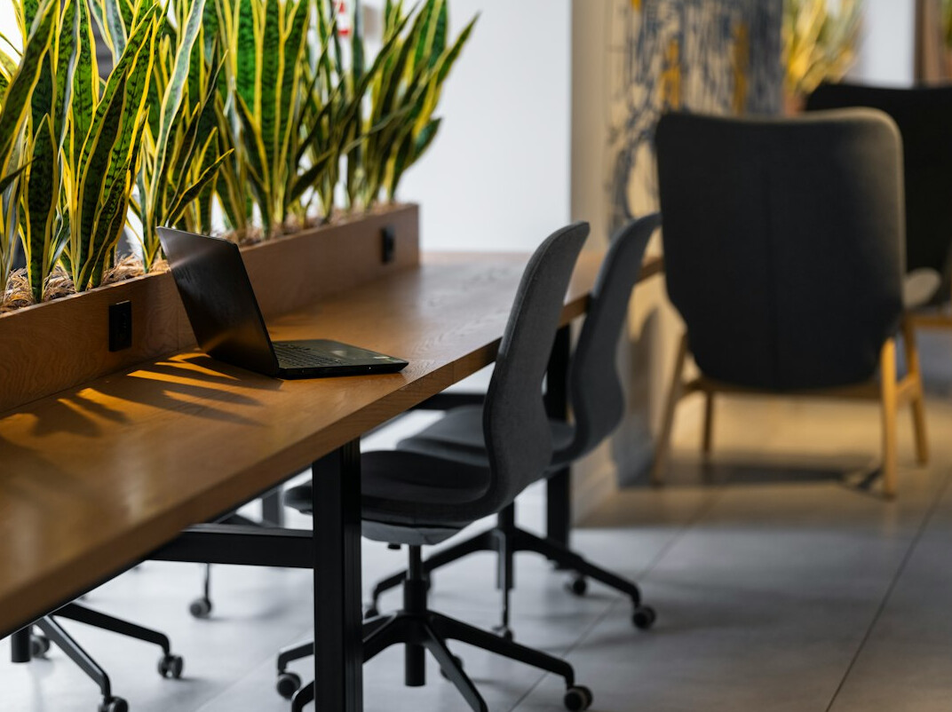 Colleagues discussing around a table in an office
